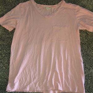 Light pink V-neck T-shirt.